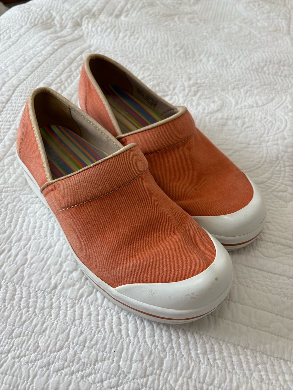 Woman’s Dansko Slip-On Canvas Shoes in Orange